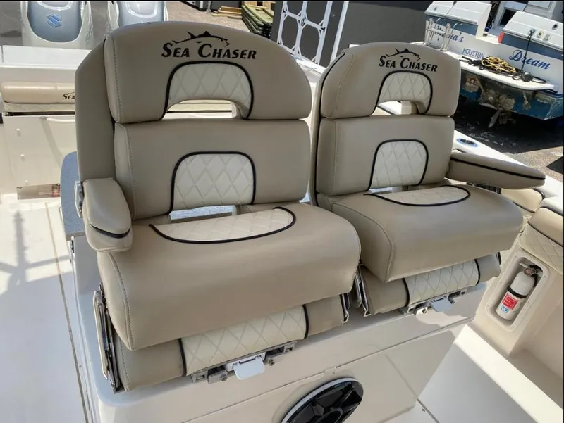 Slide: The Image of Luxurious seating on a 2020 Sea Chaser 35 HFC CC boat, featuring beige upholstery. - 16