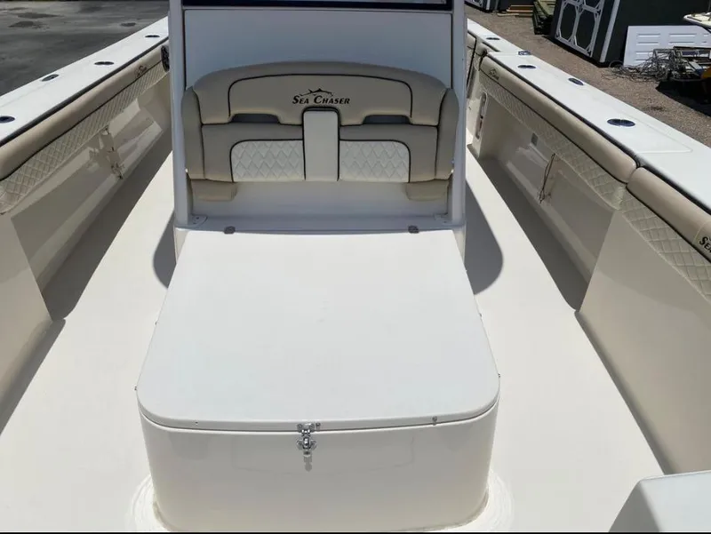Slide: The Image of 2020 Sea Chaser 35 HFC CC boat interior with cushioned seating and storage. - 21