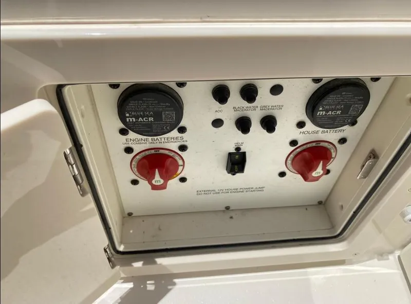 Slide: The Image of Control panel of a 2020 Sea Chaser 35 HFC CC boat, featuring battery switches. - 7
