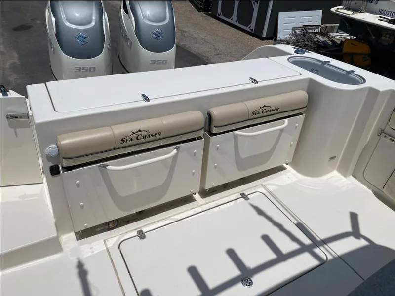 Slide: The Image of 2020 Sea Chaser 35 HFC CC boat with dual Suzuki 350 engines, featuring rear seating. - 9