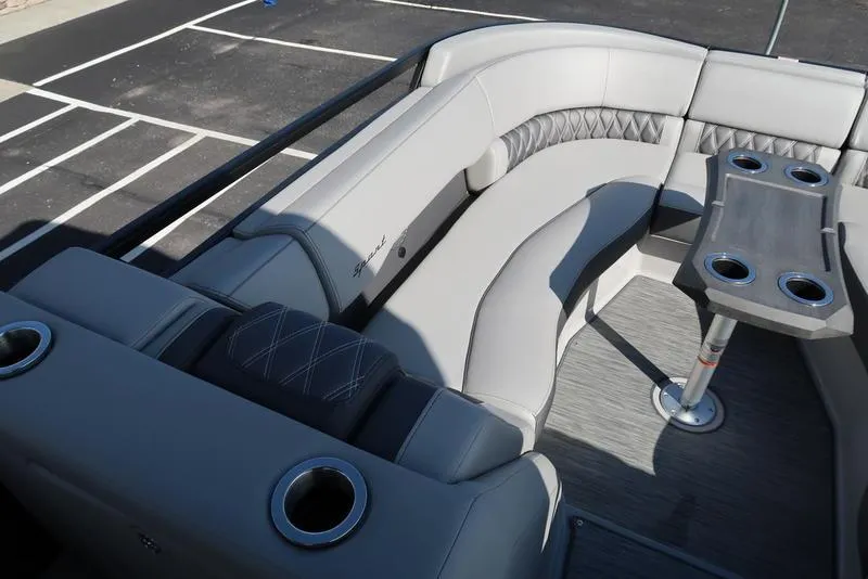 Slide: The Image of 2021 Bennington 24 RTFB boat interior with gray seating and cup holders. - 14