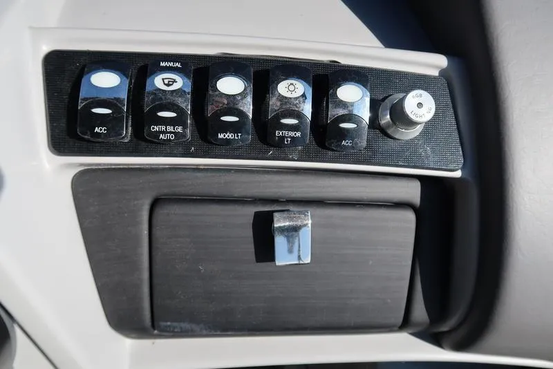 Slide: The Image of Control panel of a 2021 Bennington 24 RTFB boat with various switches and knobs. - 20