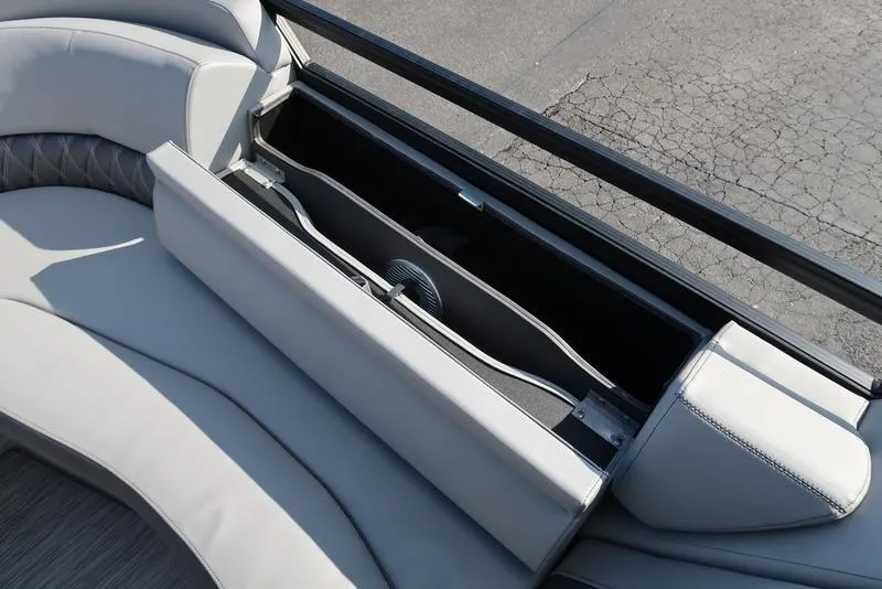 Slide: The Image of 2021 Bennington 24 RTFB boat seat storage compartment with sleek design and ample space. - 3
