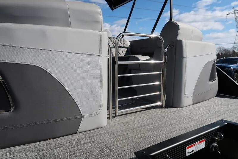 Slide: The Image of 2021 Bennington 24 RTFB pontoon boat interior with gray seating and metal gate. - 34
