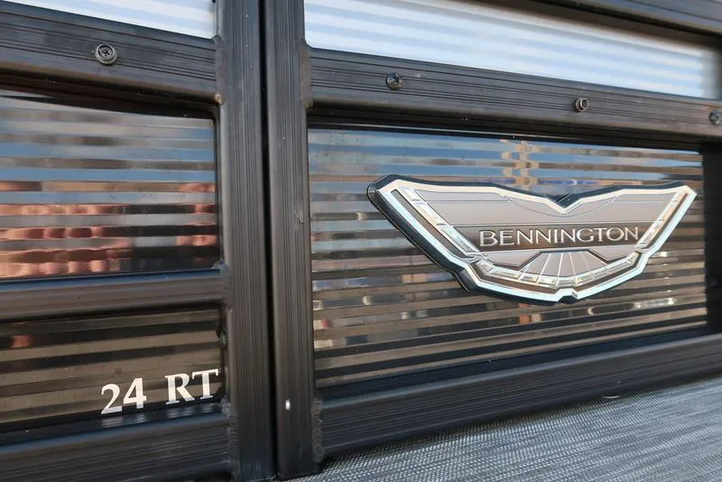 Slide: The Image of 2021 Bennington 24 RTFB boat logo and model detail on sleek black panel. - 39