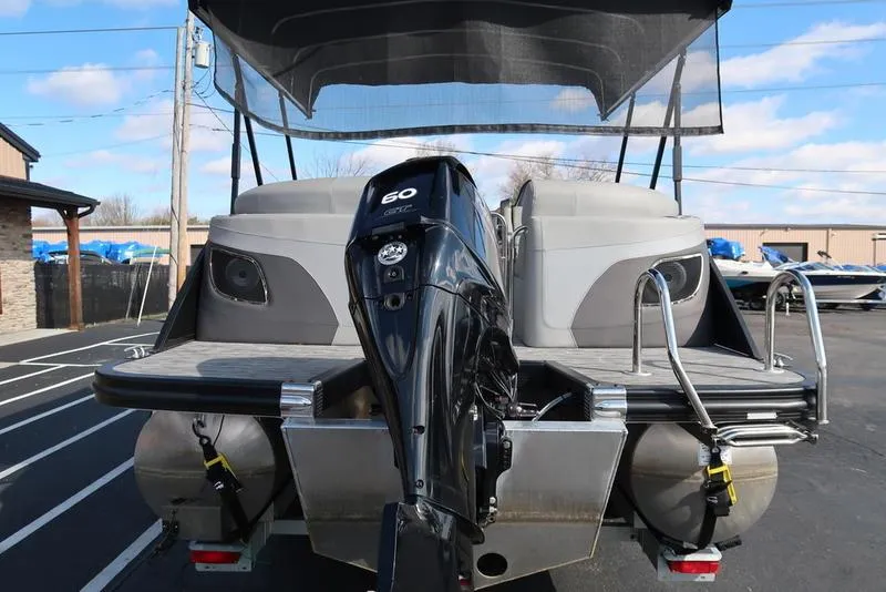 Slide: The Image of 2021 Bennington 24 RTFB pontoon boat with 60 HP outboard motor, rear view. - 45