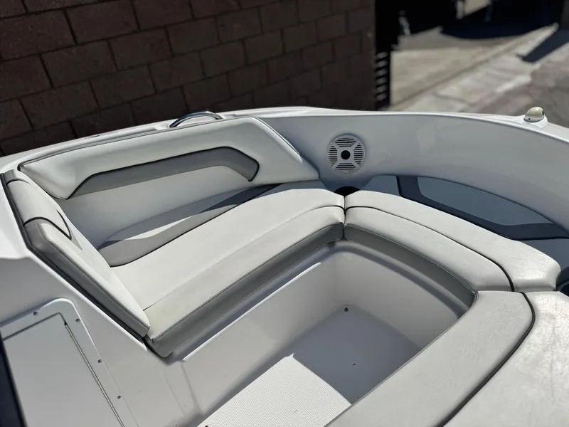 Slide: The Image of 2018 Yamaha AR190 boat interior with cushioned seating and speaker. - 12