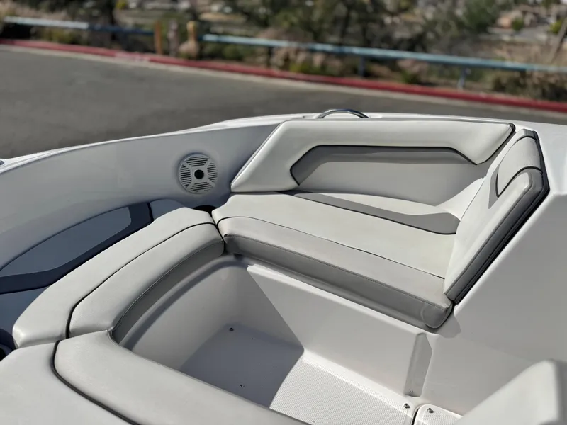 Slide: The Image of 2018 Yamaha AR190 boat interior with cushioned seating and speaker. - 13