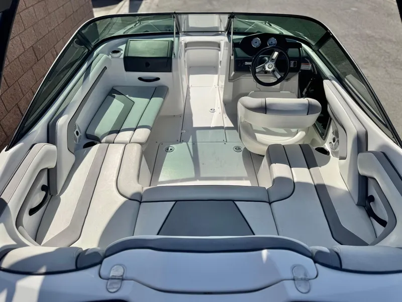 Slide: The Image of 2018 Yamaha Boats AR190 interior with sleek seating and modern dashboard. - 14