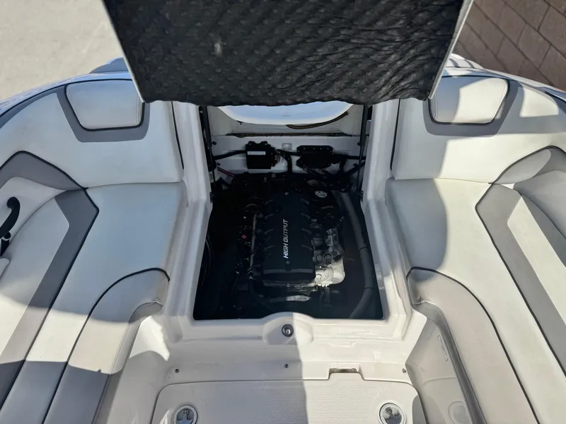 Slide: The Image of 2018 Yamaha AR190 boat engine compartment with open hatch, showcasing interior details. - 17