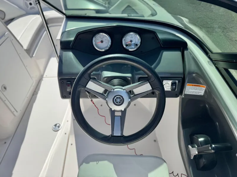 Slide: The Image of 2018 Yamaha Boats AR190 steering wheel and dashboard with gauges. - 23