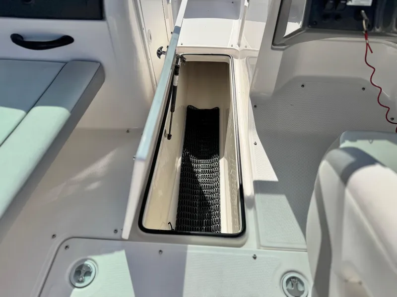 Slide: The Image of 2018 Yamaha AR190 boat interior storage compartment with open hatch. - 24