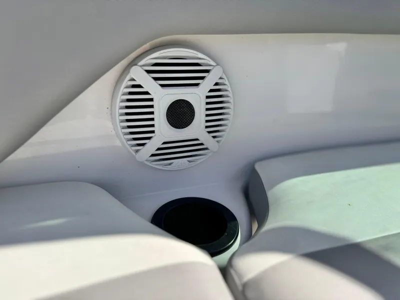 Slide: The Image of Speaker and cup holder on 2018 Yamaha AR190 boat interior. - 26