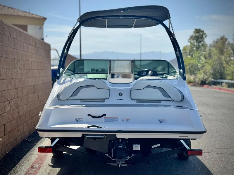 Slide: The Image of 2018 Yamaha Boats AR190 on trailer, rear view, parked outdoors. - 4