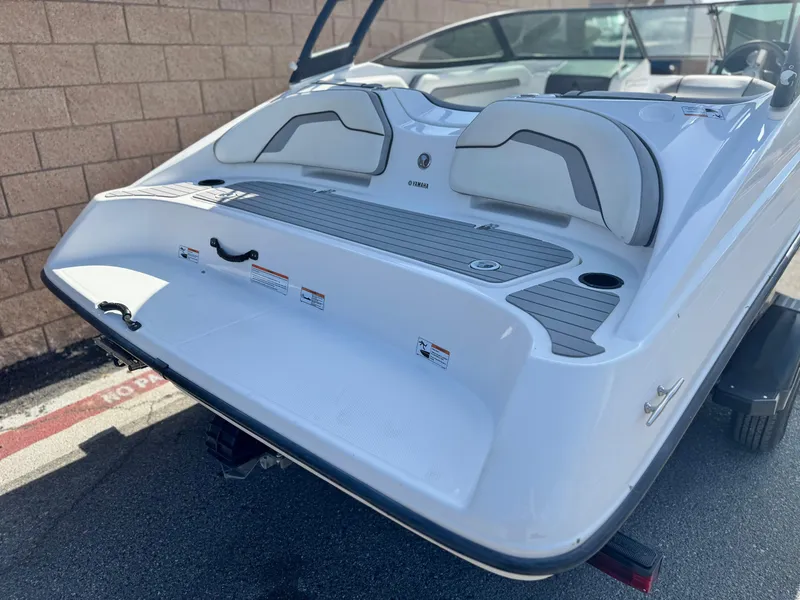 Slide: The Image of 2018 Yamaha AR190 boat rear view with seating and swim platform. - 6