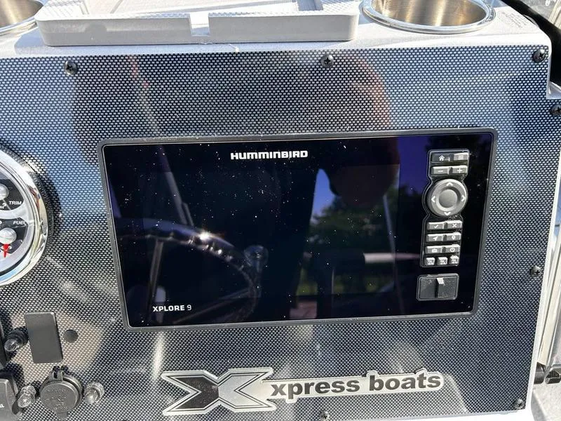 Slide: The Image of Dashboard of 2025 Xpress H20B boat with Humminbird Xplore 9 display. - 16