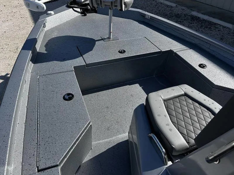 Slide: The Image of 2025 Xpress H20B boat interior with gray seating and storage compartments. - 5