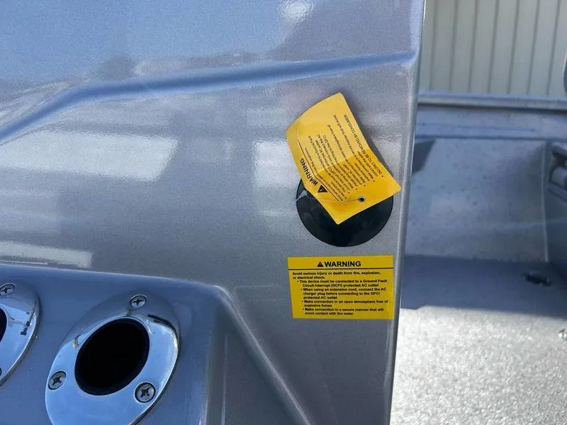 Slide: The Image of 2025 Xpress H20B boat dashboard with warning labels and metallic finish. - 6