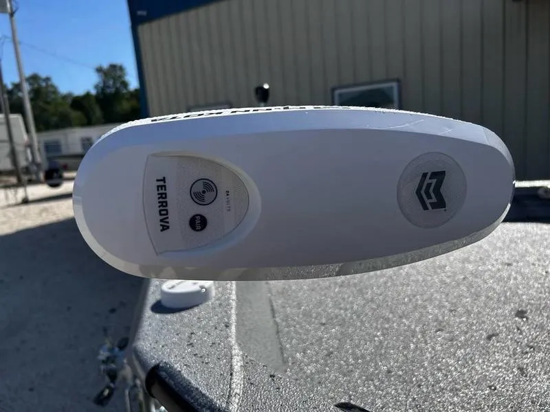 Slide: The Image of Close-up of a 2025 Xpress H20B boat's Terrova trolling motor in a sunny outdoor setting. - 7