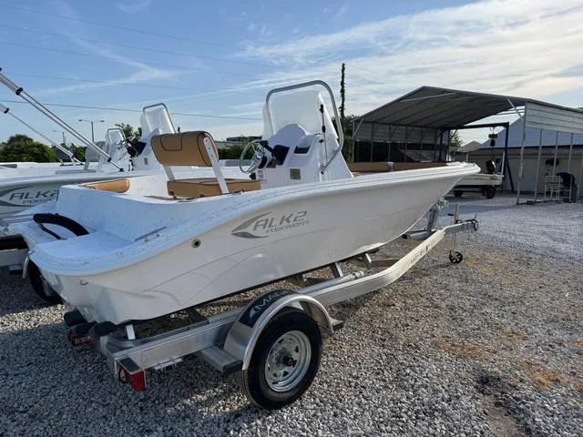 Slide: The Image of 2025 ALK2 18CRS GPS - STEREO boat on trailer, parked outdoors. - 6