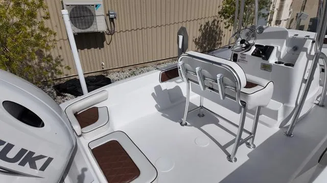 Slide: The Image of Modern ALK2 22CRX boat interior, 2025 model, featuring Suzuki engine and sleek seating design. - 15