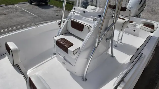 Slide: The Image of 2025 ALK2 22CRX boat interior with white and brown seating, sleek design. - 19