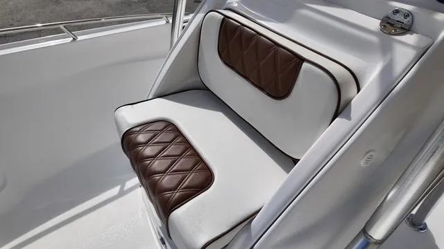 Slide: The Image of Luxurious brown and white leather seating on ALK2 22CRX 2025 boat. - 5