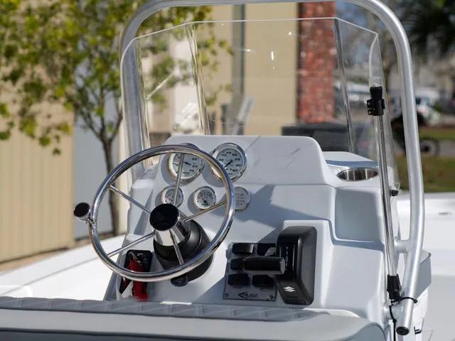 Slide: The Image of Control panel of ALK2 17HS boat, 2025 model, featuring steering wheel and gauges. - 11