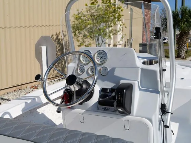 Slide: The Image of Steering console of 2025 ALK2 17HS boat with gauges and controls. - 13