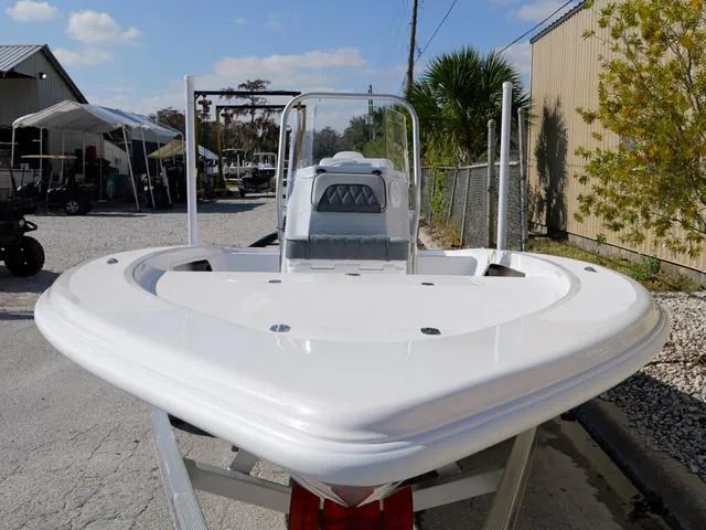 Slide: The Image of 2025 ALK2 17HS boat on trailer, white deck, outdoor setting, clear sky. - 16