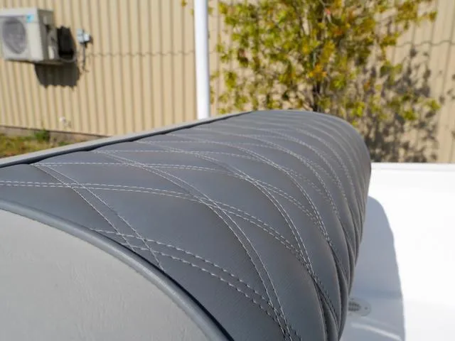 Slide: The Image of Quilted gray leather seat on ALK2 17HS, 2025 model, with outdoor background. - 17