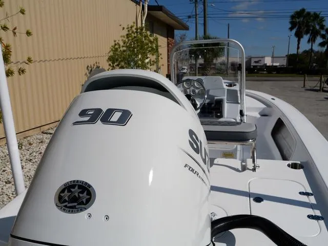 Slide: The Image of Boat with 90 HP engine, ALK2 17HS model, 2025, parked outdoors. - 21