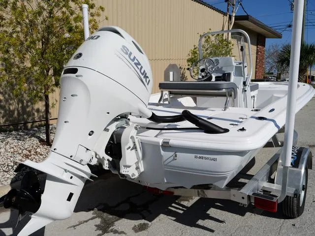 Slide: The Image of White ALK2 17HS boat with Suzuki outboard motor on a trailer, 2025 model. - 22