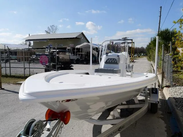 Slide: The Image of 2025 ALK2 17HS boat on trailer in marina setting, sunny day. - 23