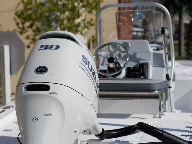 Slide: The Image of White Suzuki 90 outboard motor on ALK2 17HS boat, 2025 model, with steering console. - 7