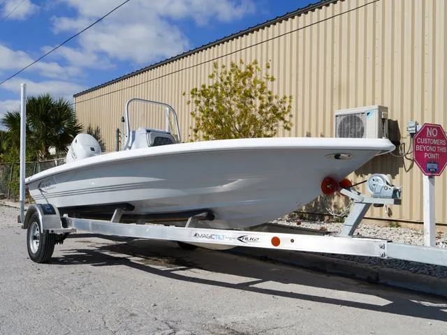 Slide: The Image of 2025 ALK2 17HS boat on trailer, parked outside a metal building. - 8