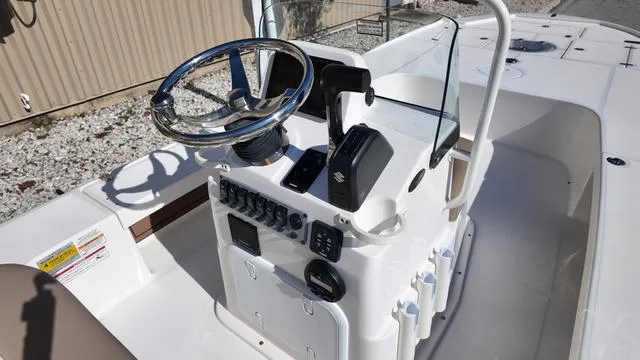 Slide: The Image of 2025 Spyder Boats FX19 Vapor console with steering wheel and controls. - 10