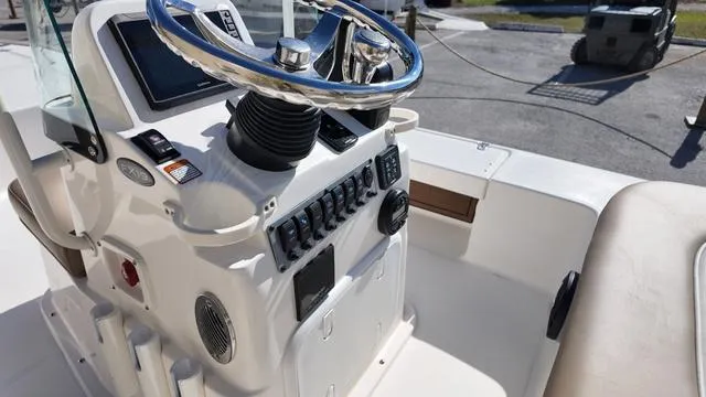 Slide: The Image of 2025 Spyder Boats FX19 Vapor console with steering wheel and controls. - 13