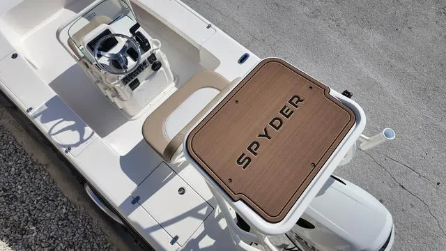 Slide: The Image of 2025 Spyder Boats FX19 Vapor, top view of helm and deck details. - 22