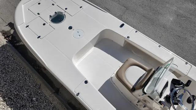 Slide: The Image of 2025 Spyder Boats FX19 Vapor, top view of sleek white deck and console. - 23