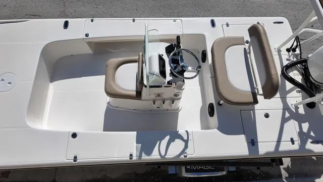 Slide: The Image of 2025 Spyder Boats FX19 Vapor, top view of sleek interior and steering console. - 24