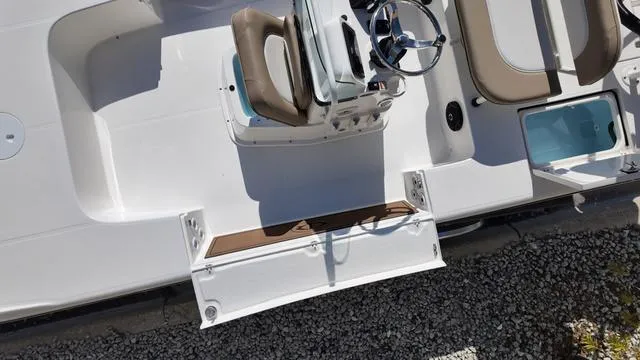 Slide: The Image of 2025 Spyder Boats FX19 Vapor interior with steering wheel and seating, viewed from above. - 28