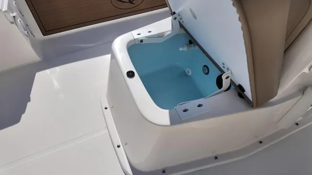 Slide: The Image of 2025 Spyder Boats FX19 Vapor livewell with open lid on deck. - 31