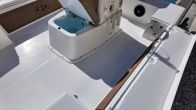 Slide: The Image of 2025 Spyder Boats FX19 Vapor deck with seating and storage compartments. - 32