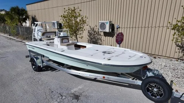 Slide: The Image of 2025 Spyder Boats FX19 Vapor on trailer, parked outdoors. - 37