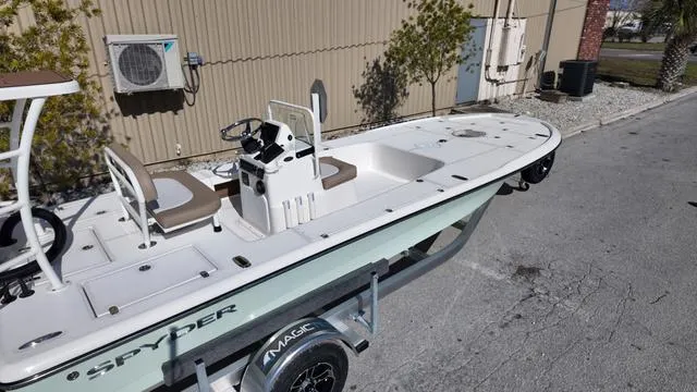 Slide: The Image of 2025 Spyder Boats FX19 Vapor on trailer, parked outdoors. - 39