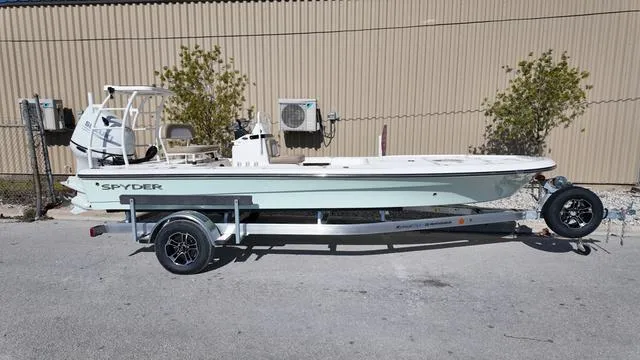 Slide: The Image of 2025 Spyder Boats FX19 Vapor on trailer, parked outdoors. - 4
