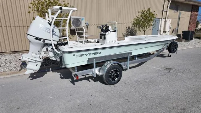 Slide: The Image of 2025 Spyder Boats FX19 Vapor on trailer, parked outdoors. - 5