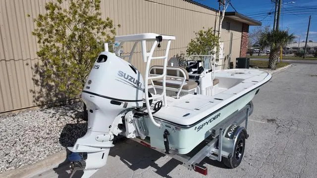 Slide: The Image of 2025 Spyder Boats FX19 Vapor with Suzuki engine on trailer, parked outdoors. - 6