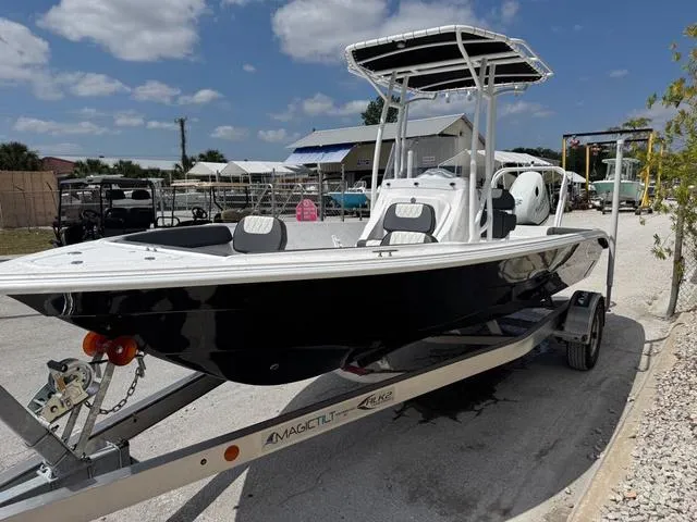 Slide: The Image of 2025 ALK2 22CRS boat on trailer, featuring GPS and stereo, parked outdoors. - 12
